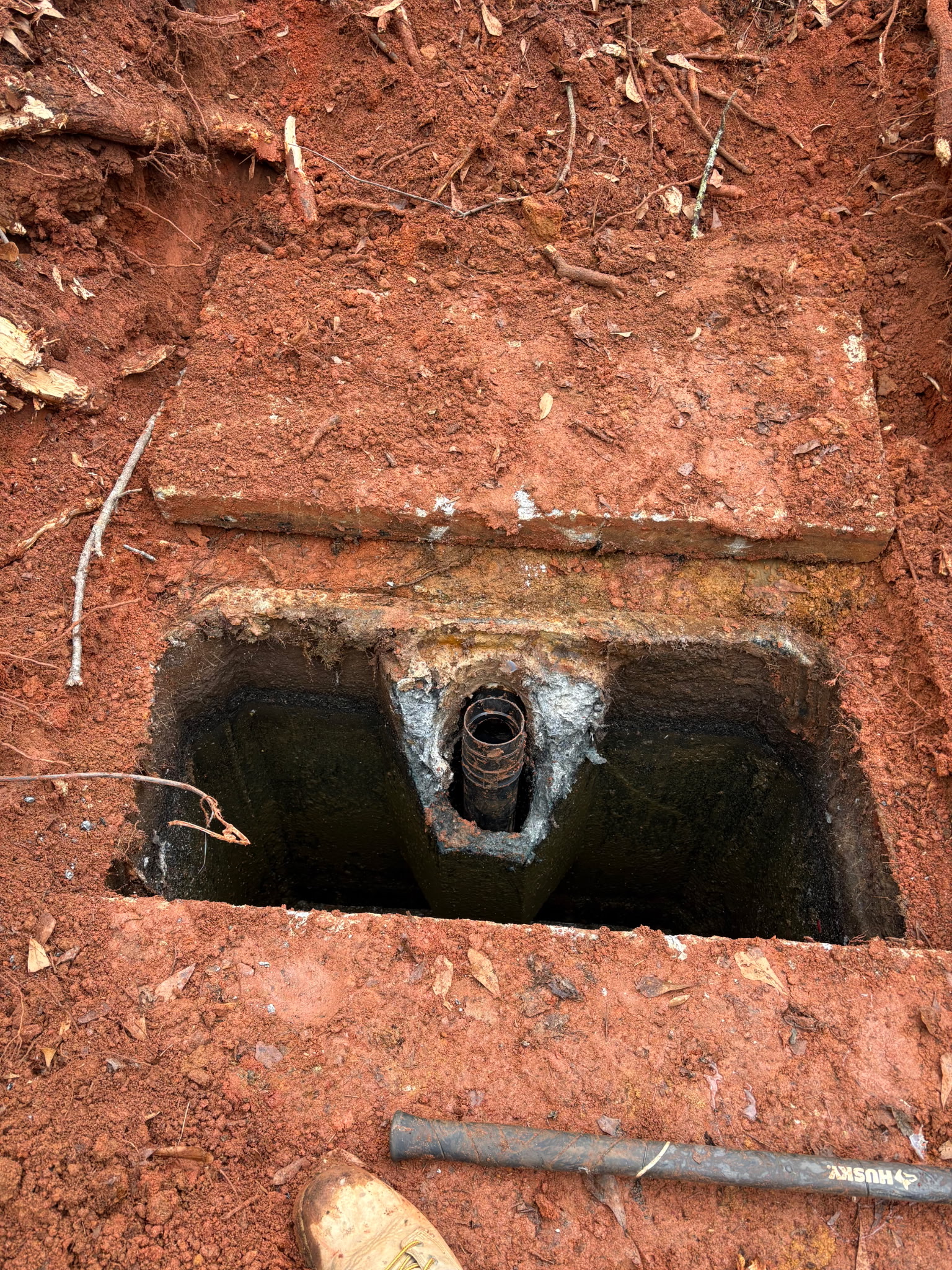 Interior view of old concrete septic tank opened for inspection by Sanders Septic LLC Loganville GA