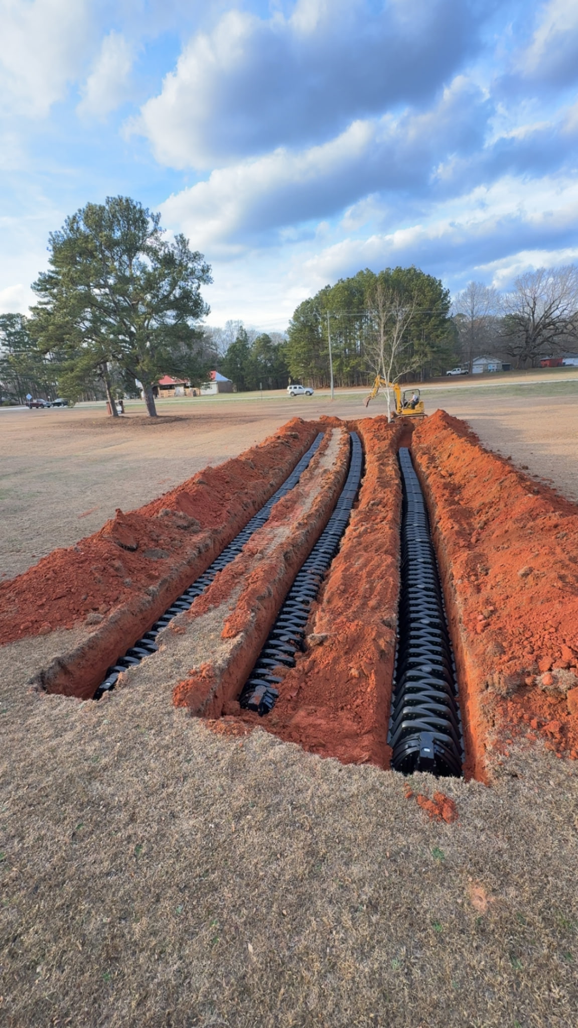 Close-up of drain field chamber installation by Sanders Septic in Walton County Georgia red clay
