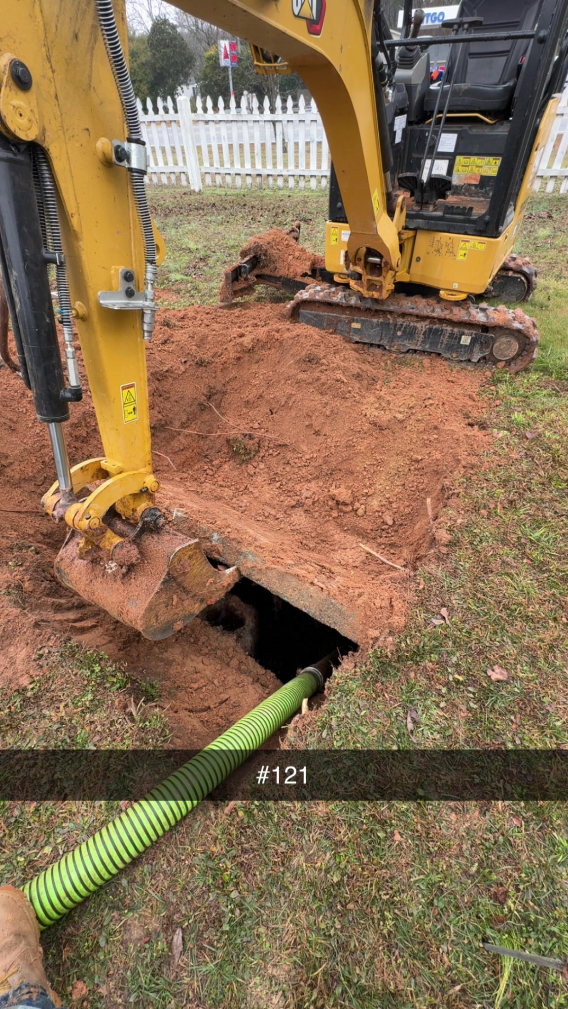 CAT mini excavator used by Sanders Septic LLC during septic tank excavation and pumping in Loganville Georgia