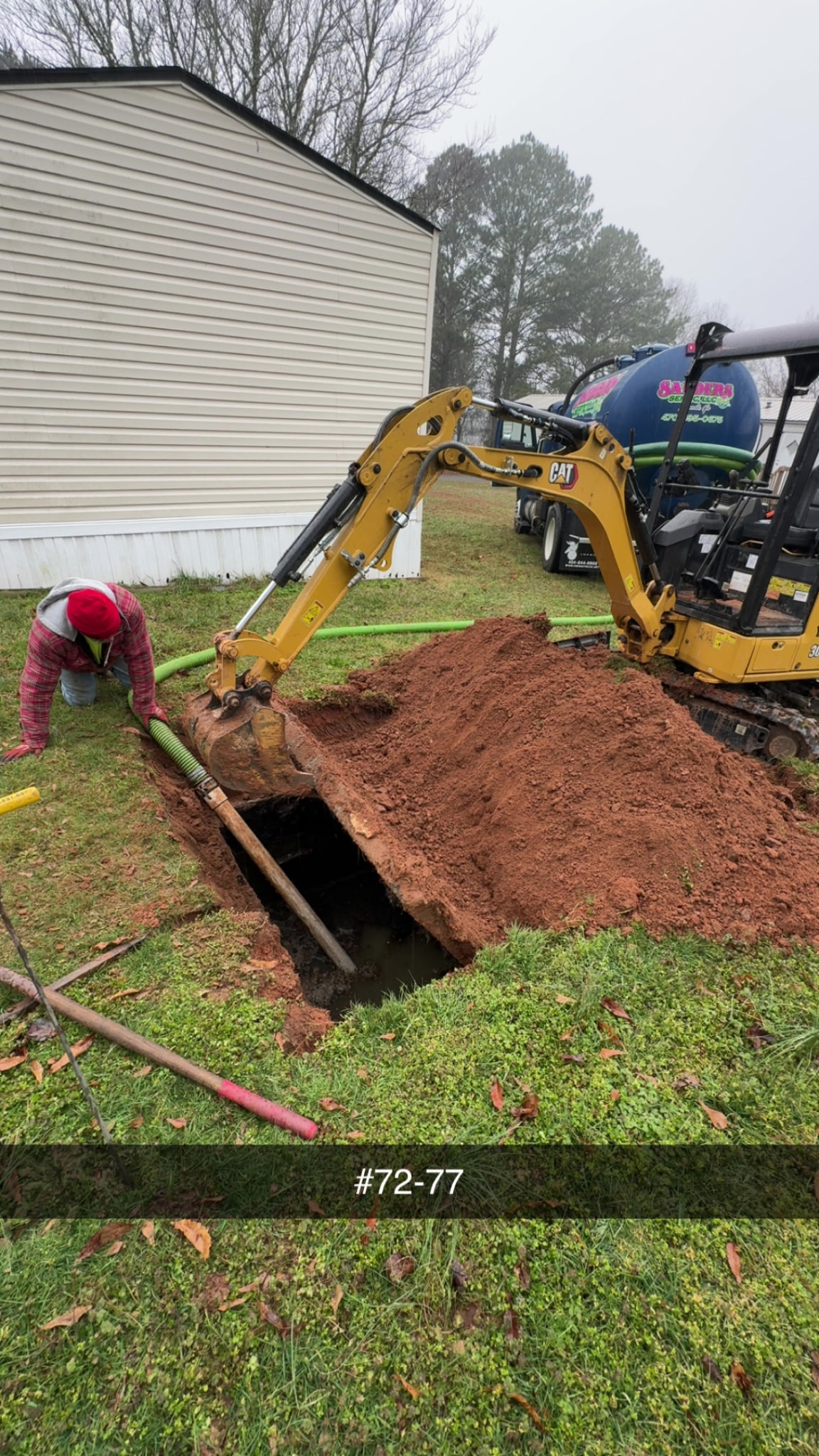 Sanders Septic pump truck and mini excavator at work on residential septic system in Loganville GA