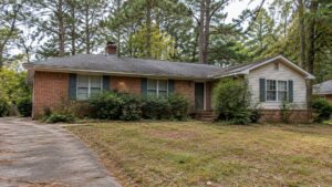 Older brick ranch with a siding addition and tired yard, East Metro fixer